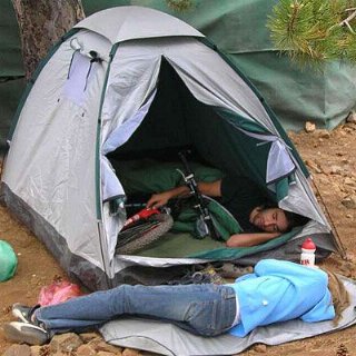 couple and bike with tent